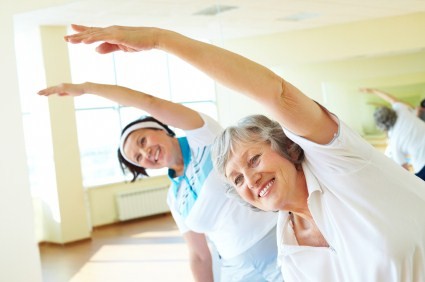 2 elderly women at an exercise class.