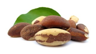 A selection of Brazil nuts on a white background.