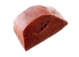 A raw piece of liver on a white background.