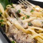 A close up shot of a pasta and mushroom dish.