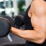 A man performing bicep curls with dumbbells.