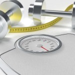 A set of dumbbells, a tape measure and a pair of weighing scales.