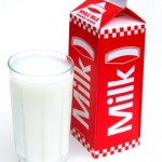 A glass and carton of milk.