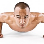 A close up of a man doing a pressup.