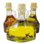 3 glass bottles of olive oil.