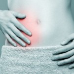 A woman with stomach pain highlighted in red.