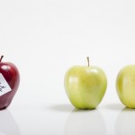 A red apple with the label "bad apple" next to two green apples.
