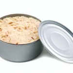 A can of tinned tuna on a white background.