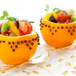 Fruit salad within a festive Christingle.