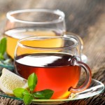 2 clear glass cups of tea.