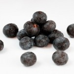 A selection of Acai berries on a white background.