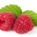 2 raspberries with the leaves attached.