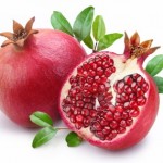 A whole and half pomegranate.