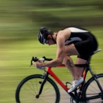 A competitive cyclist on a country road.