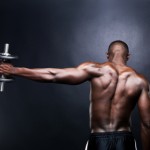 A man doing a dumbbell lateral raise.