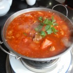 A large pot of beef and chilli soup.