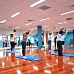 People exercising in a yoga class.