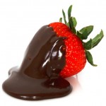 A strawberry covered in dark chocolate.
