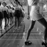 A group of women dancing in a studio.